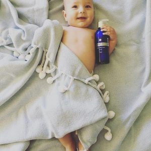 Baby with body lotion optimised